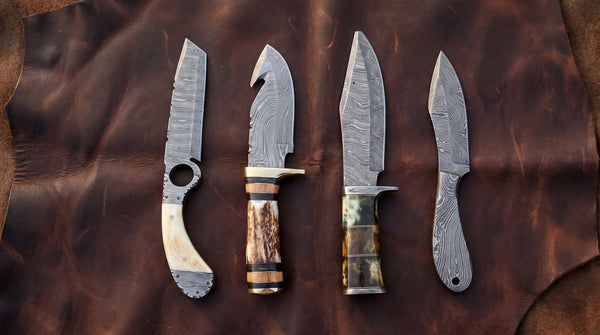 A hunter using a drop point Damascus knife to field dress game outdoors
