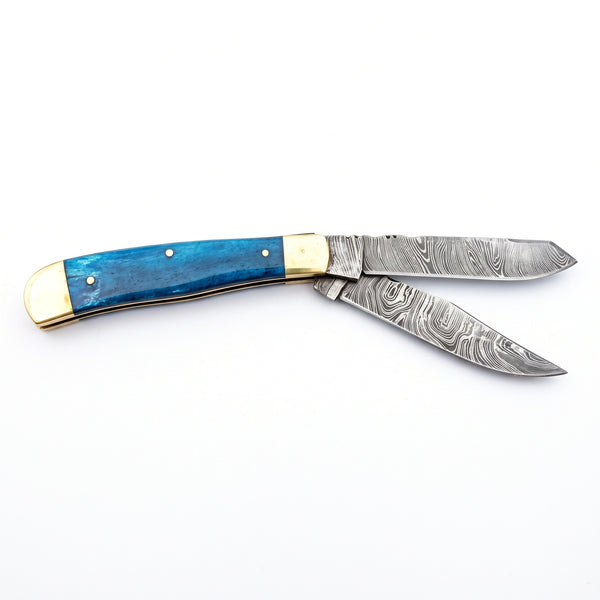 Creek 6.5" Damascus Trapper Knife | Blue Bone, side profile on white