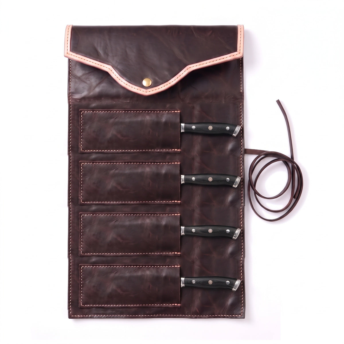 4-Piece Damascus Steak Knife Set | Black Pakkawood, seated in the Crownridge knife roll