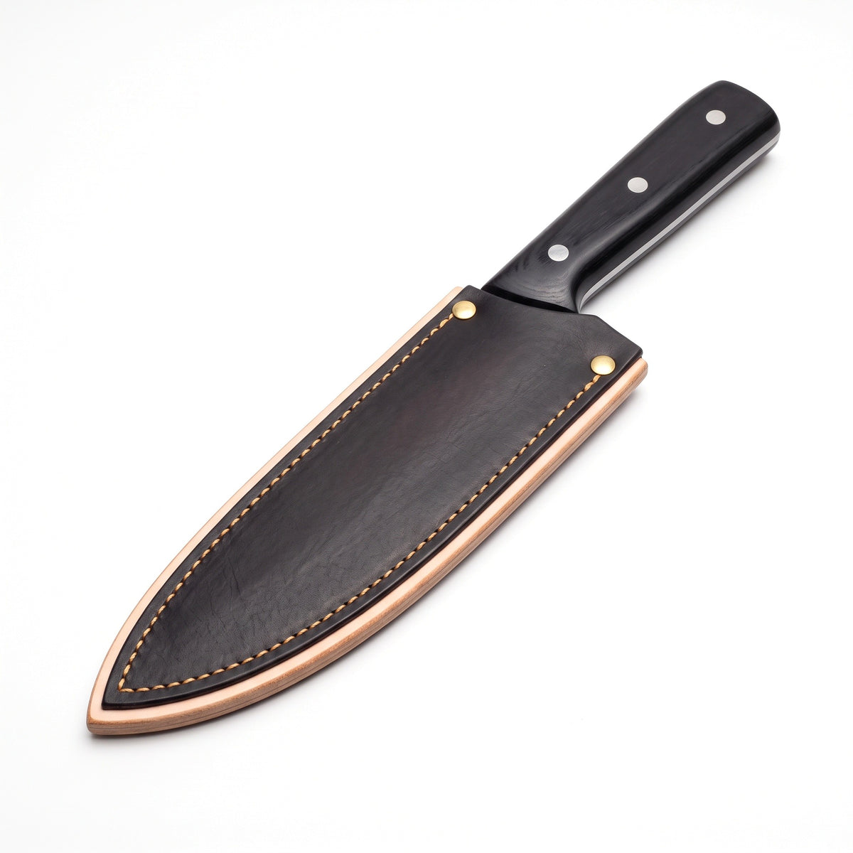 7.5" Carbon Steel Chef Knife | Pakkawood, seated in the Crownridge blade guard