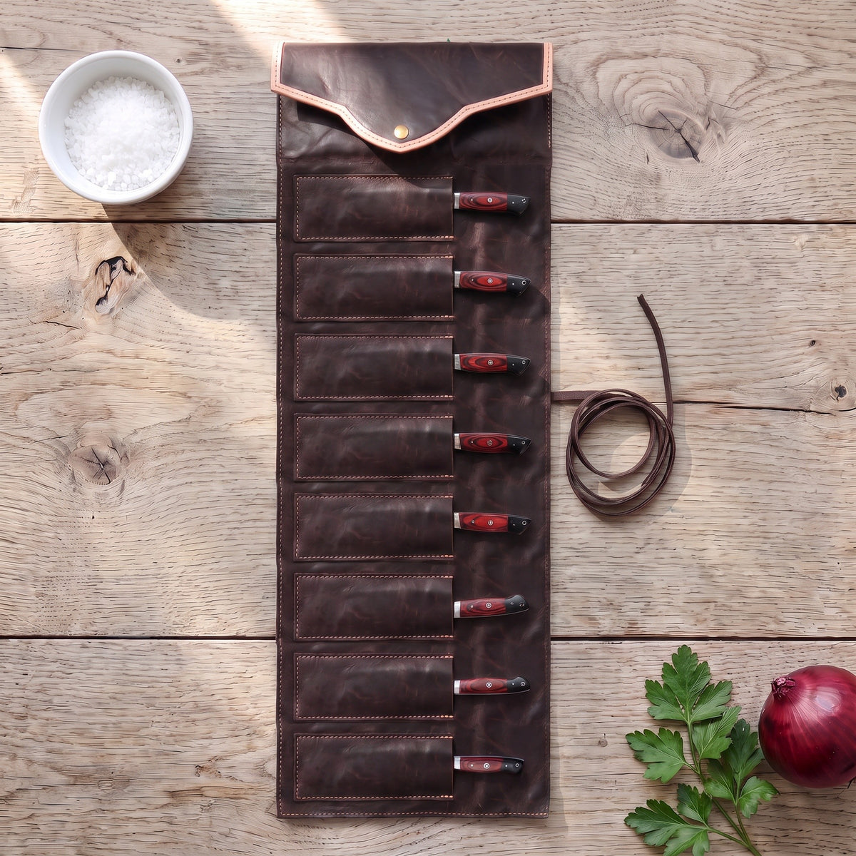 8-Piece Damascus Kitchen Knife Set | Red & Black Pakka, with the Crownridge knife roll in use