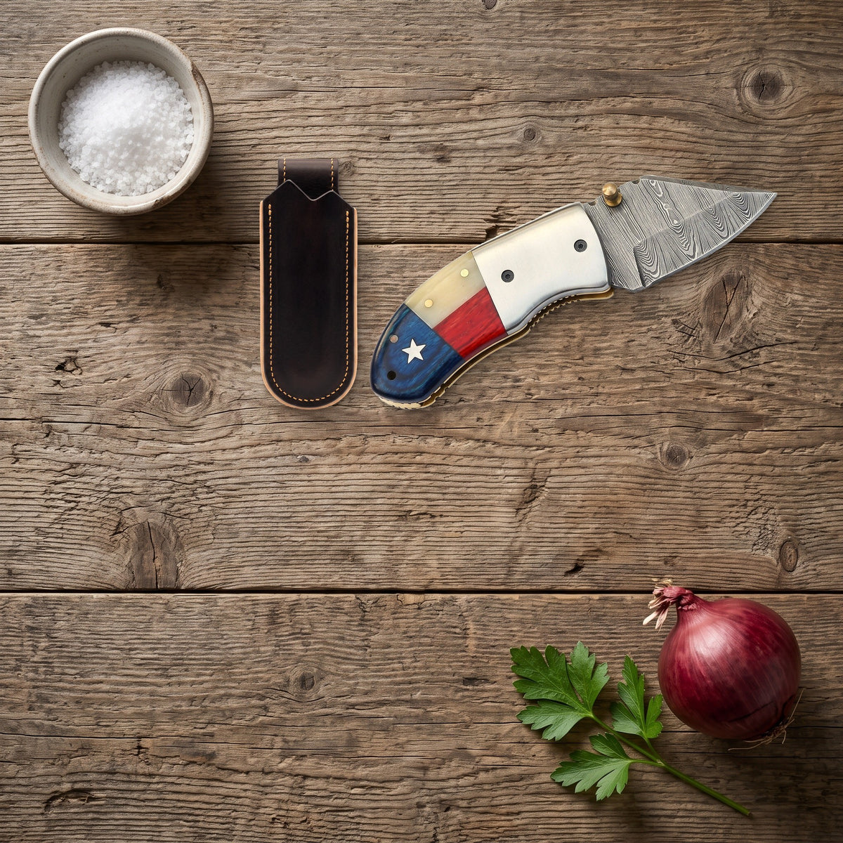 Creek 5" Damascus Pocket Knife | Bone, with the Crownridge belt slip in use