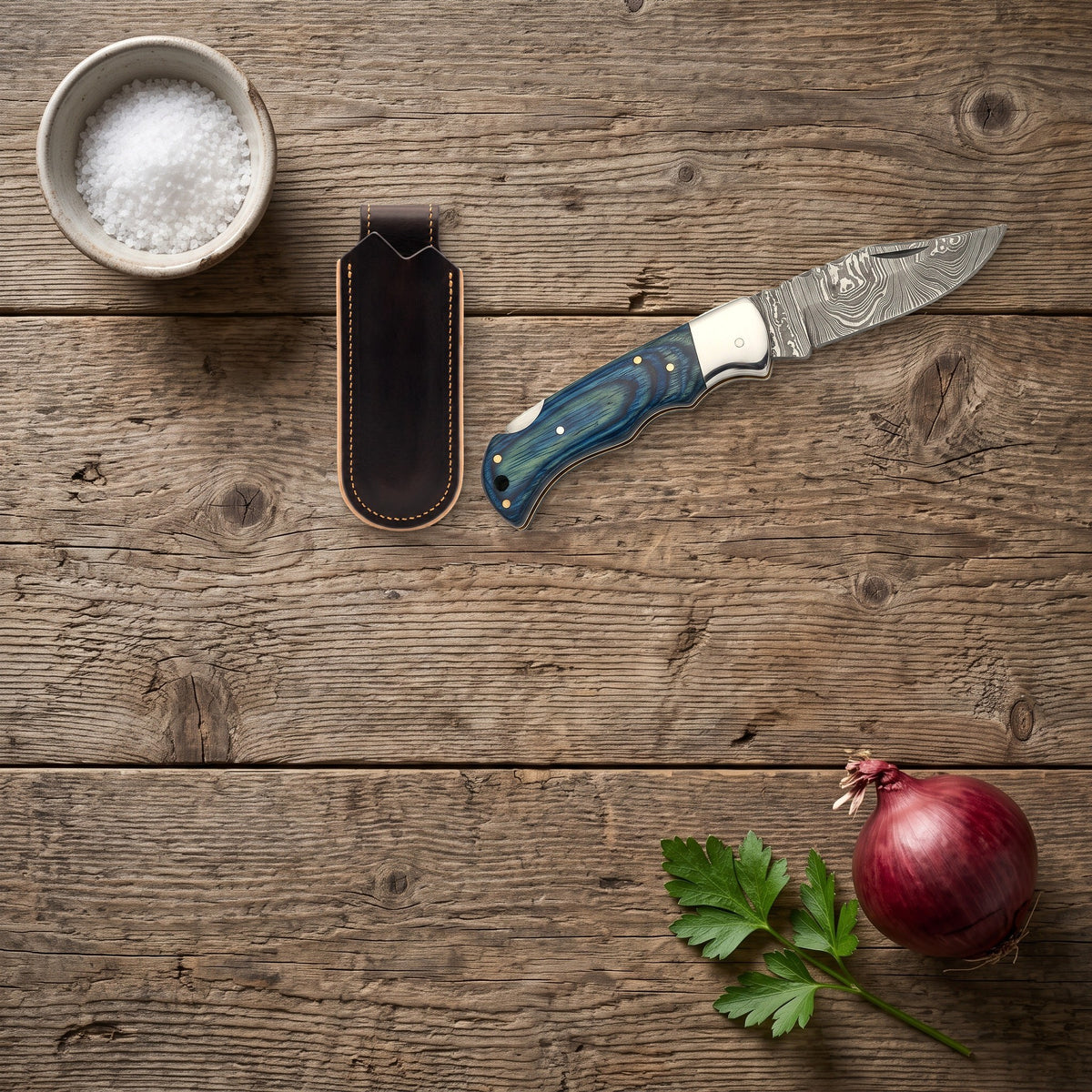 Creek 6.5" Damascus Pocket Knife | Blue Pakkawood, with the Crownridge belt slip in use