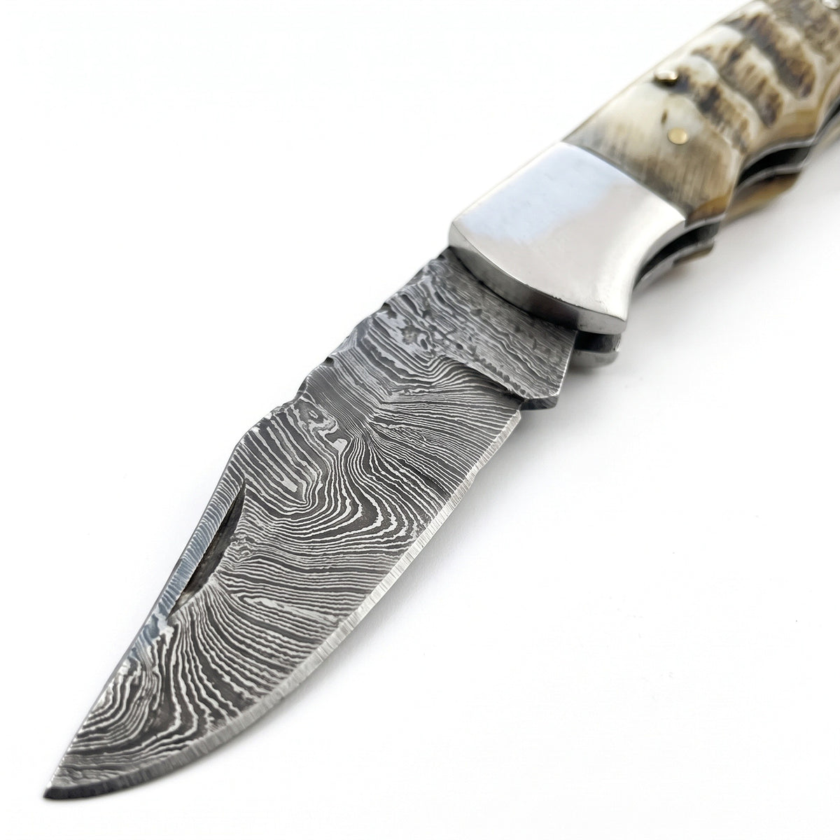 Creek 6.5" Damascus Pocket Knife | Ram Horn, Damascus blade close-up