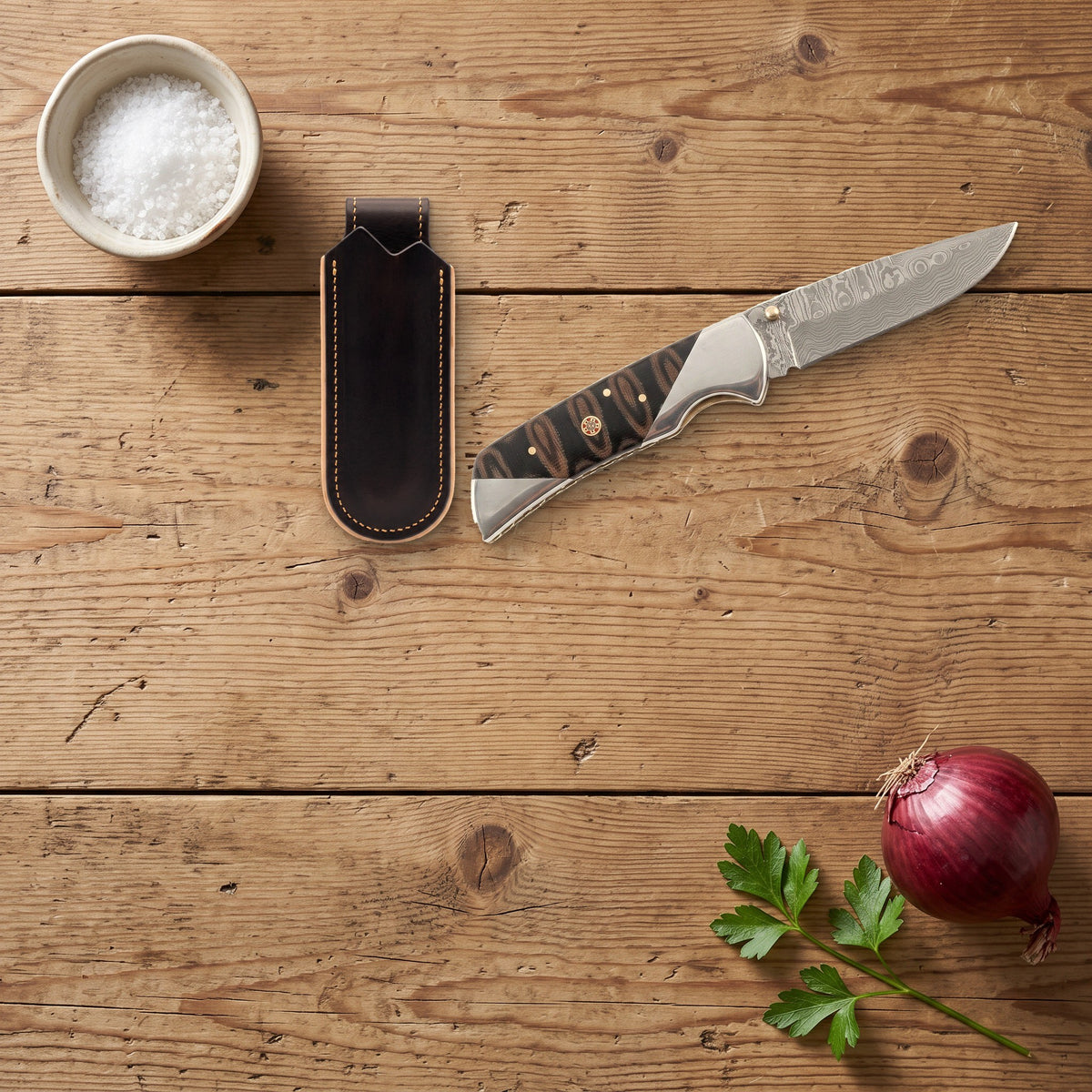 Creek 7.2" Damascus Pocket Knife | Micarta, with the Crownridge belt slip in use