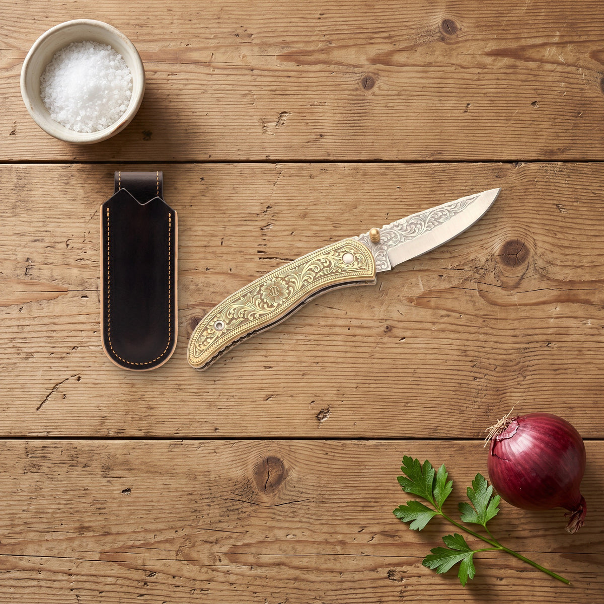 Creek 7.75" Carbon Steel Pocket Knife | Brass, with the Crownridge belt slip in use