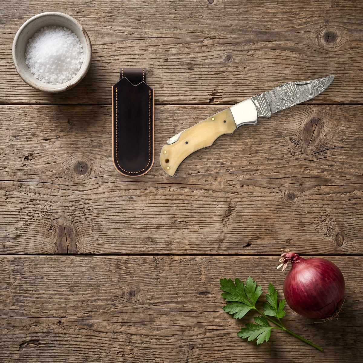 Creek 7" Damascus Clip Point Pocket Knife | Bone, with the Crownridge belt slip in use