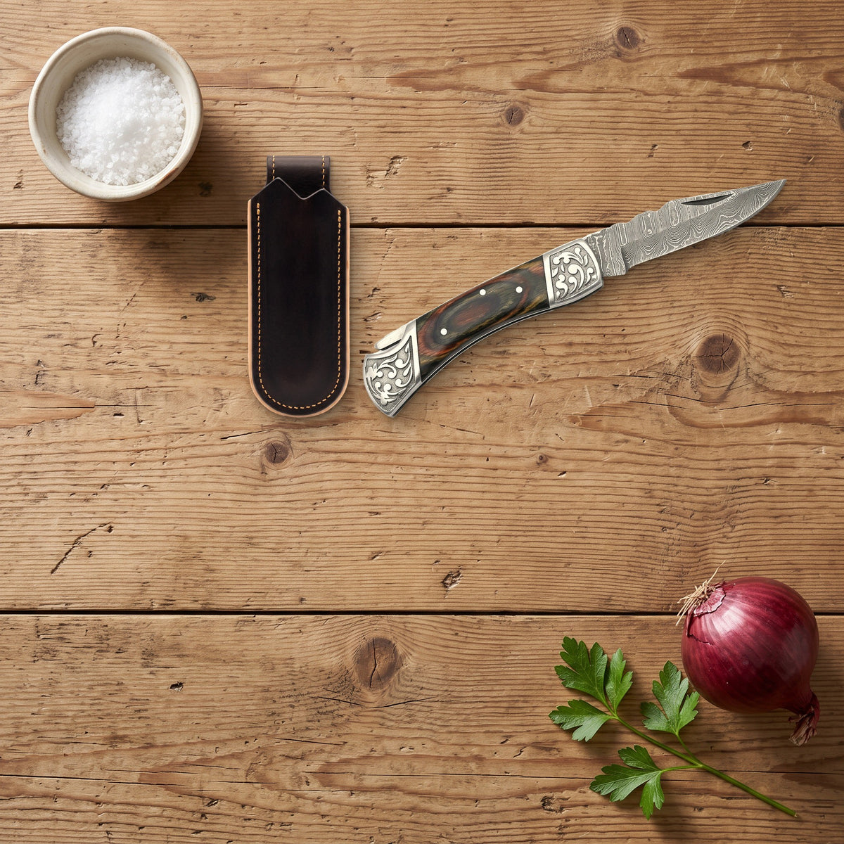 Creek 7" Damascus Drop Point Pocket Knife | Dyed Wood, with the Crownridge belt slip in use