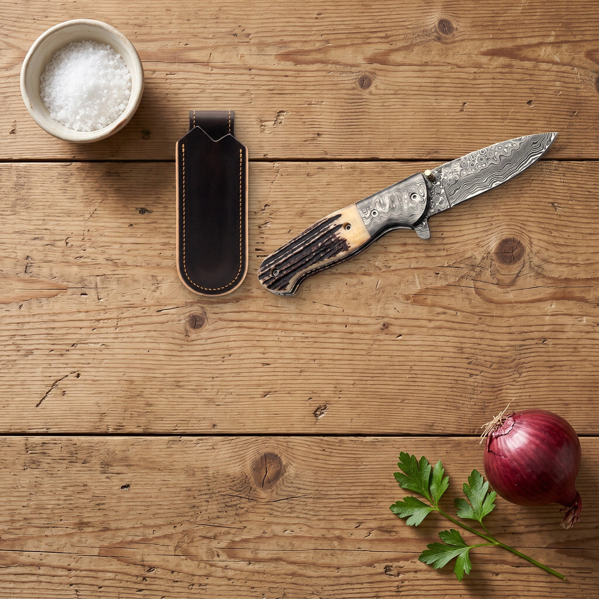 Creek 8.5" Damascus Pocket Knife | Stag, with the Crownridge belt slip in use