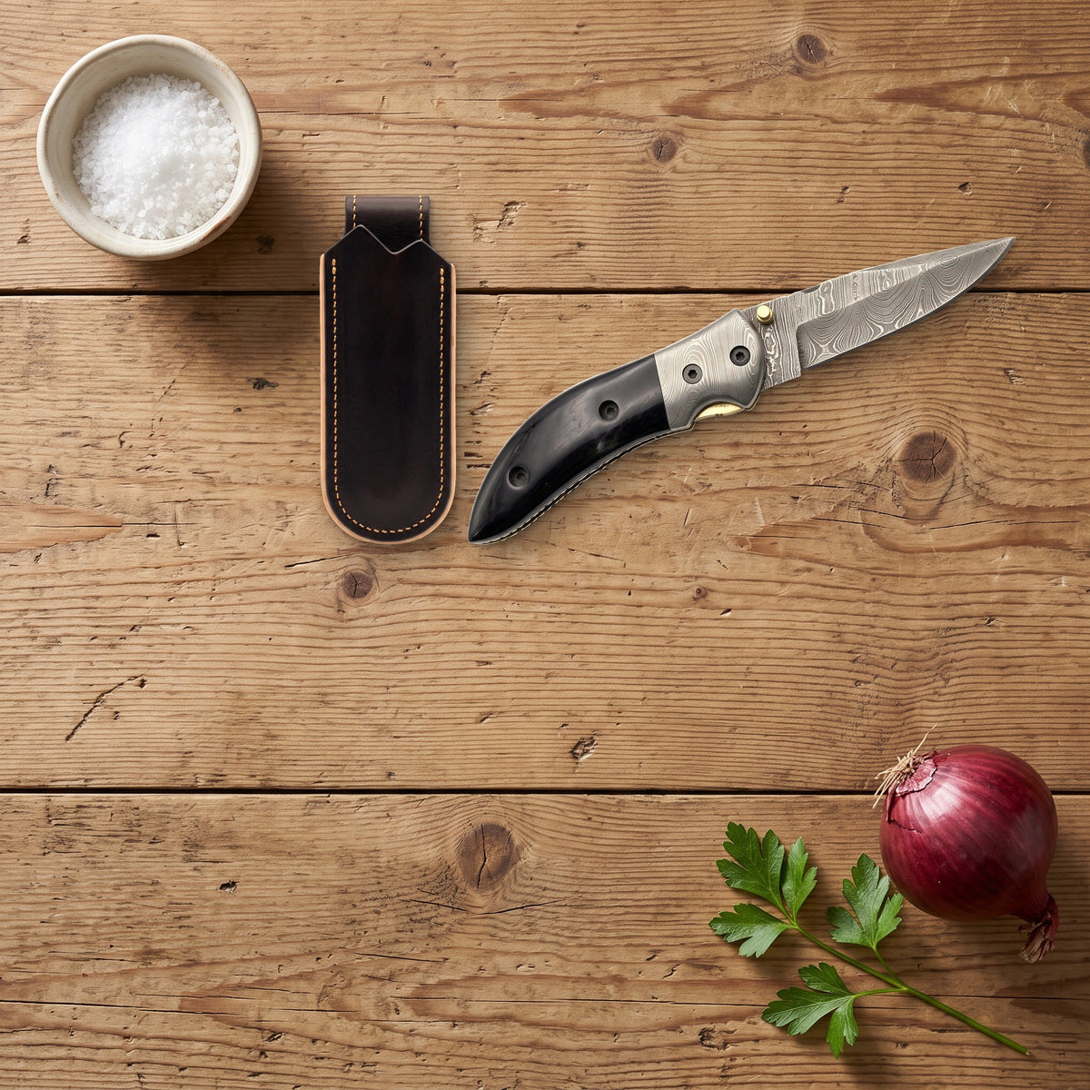 Creek 8" Damascus Pocket Knife | Buffalo Horn, with the Crownridge belt slip in use