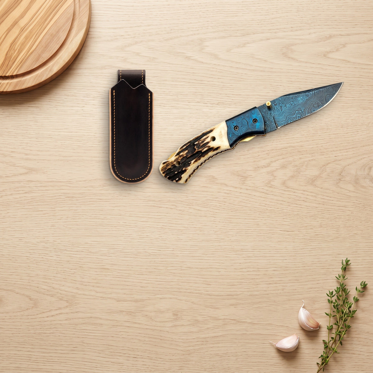 Creek 8" Damascus Pocket Knife | Stag, with the Crownridge belt slip in use