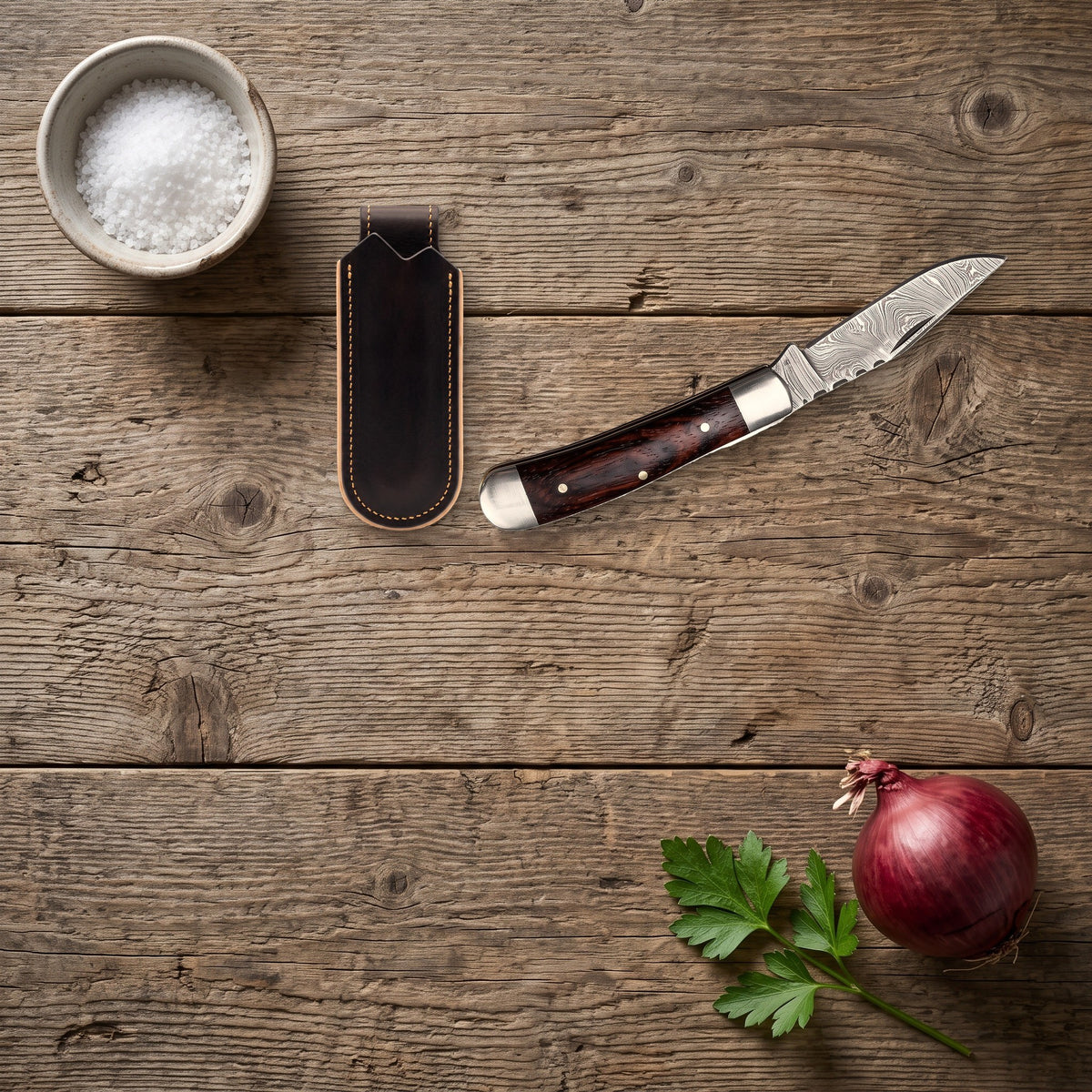 Creek 8" Damascus Trapper Knife | Rosewood, with the Crownridge belt slip in use