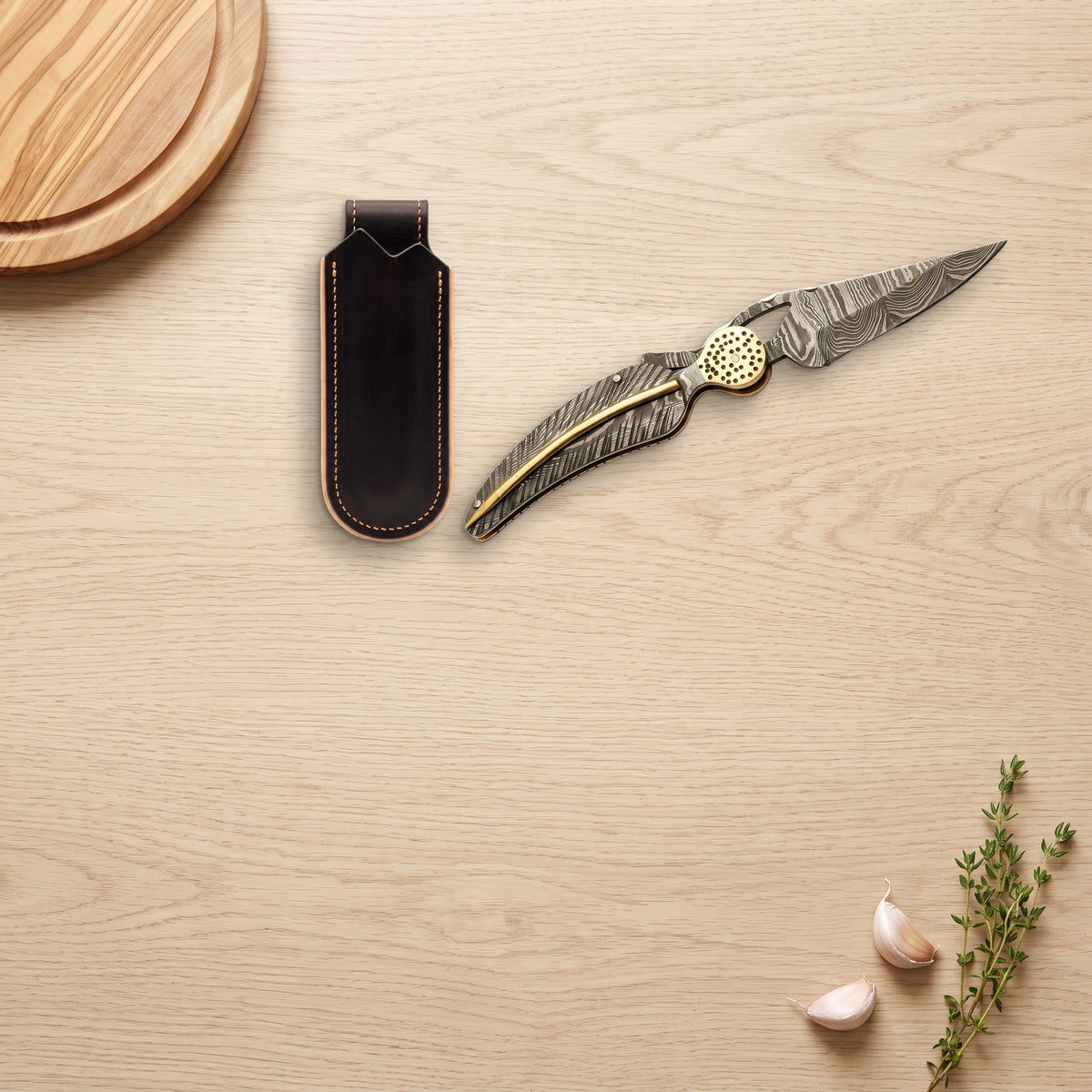 Creek 9" Damascus Pocket Knife | Brass, with the Crownridge belt slip in use