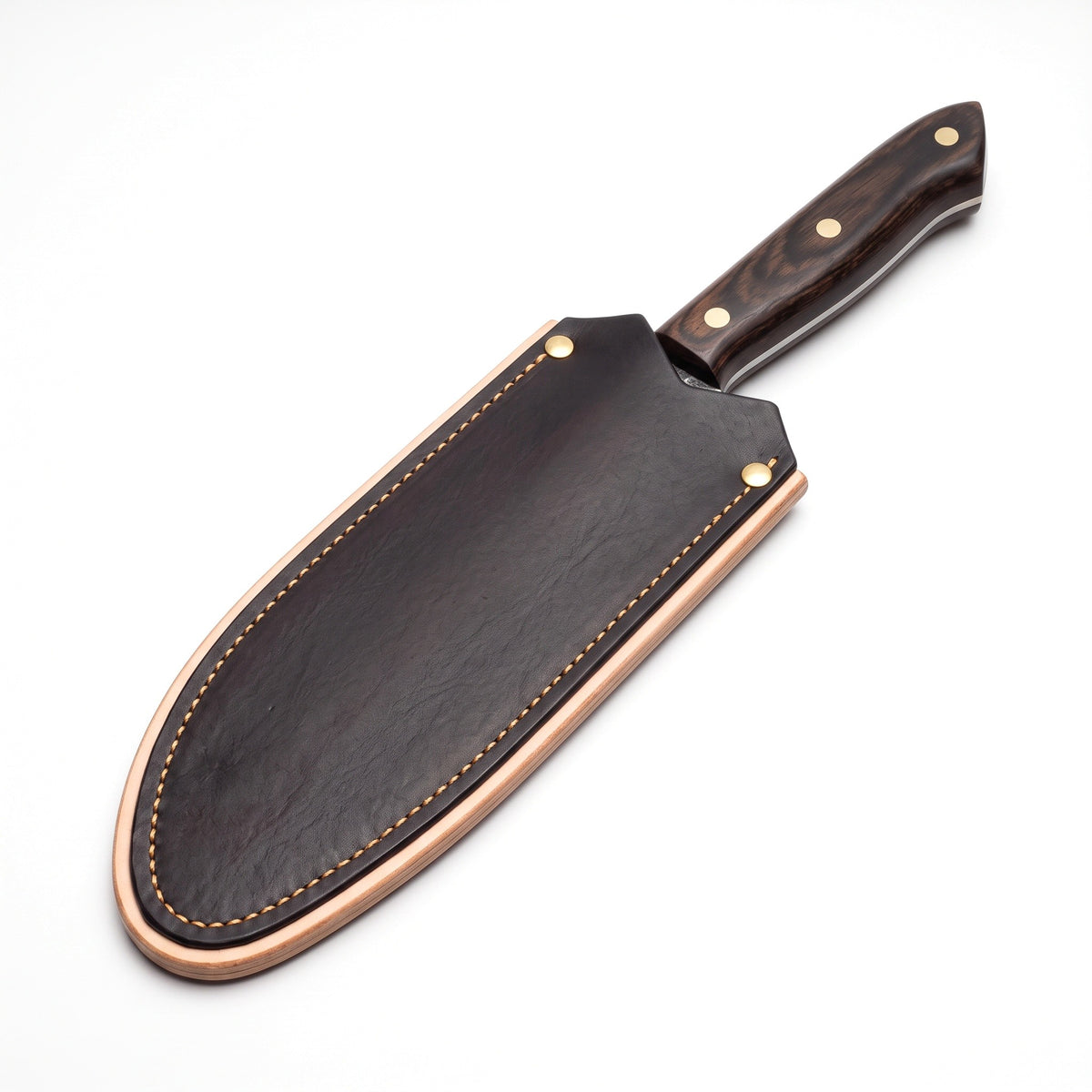 Hollow 6.75" Carbon Steel Serbian Chef Knife | Pakkawood, seated in the Crownridge blade guard