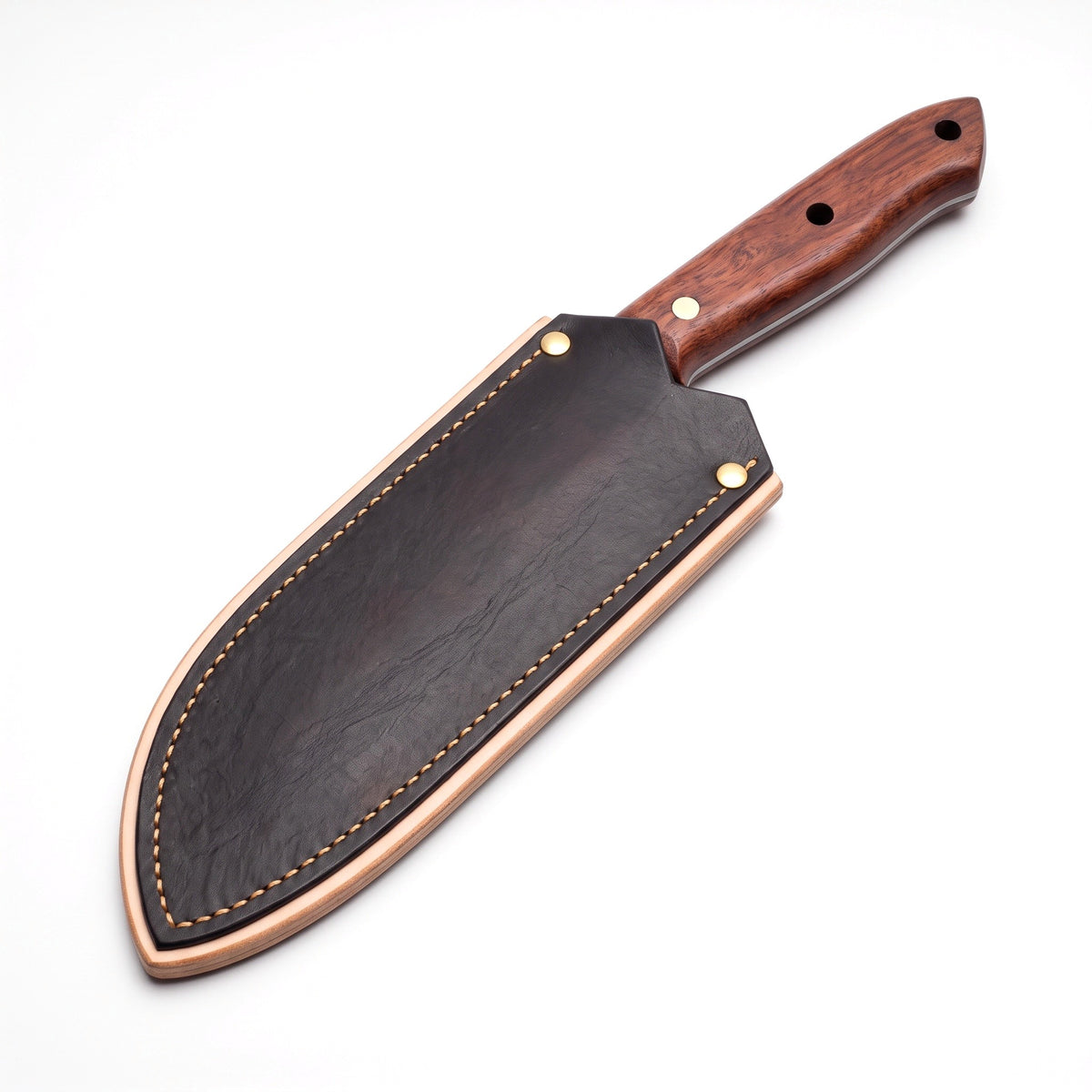 Hollow 7" Carbon Steel Serbian Chef Knife | Rosewood, seated in the Crownridge blade guard