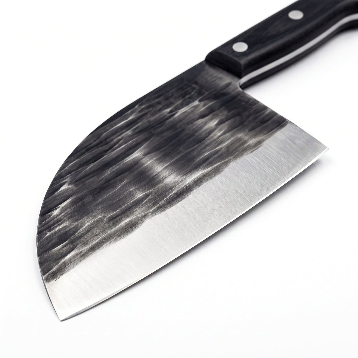 Hollow 7" Carbon Steel Serbian Chef Knife | Black Micarta, carbon steel blade close-up