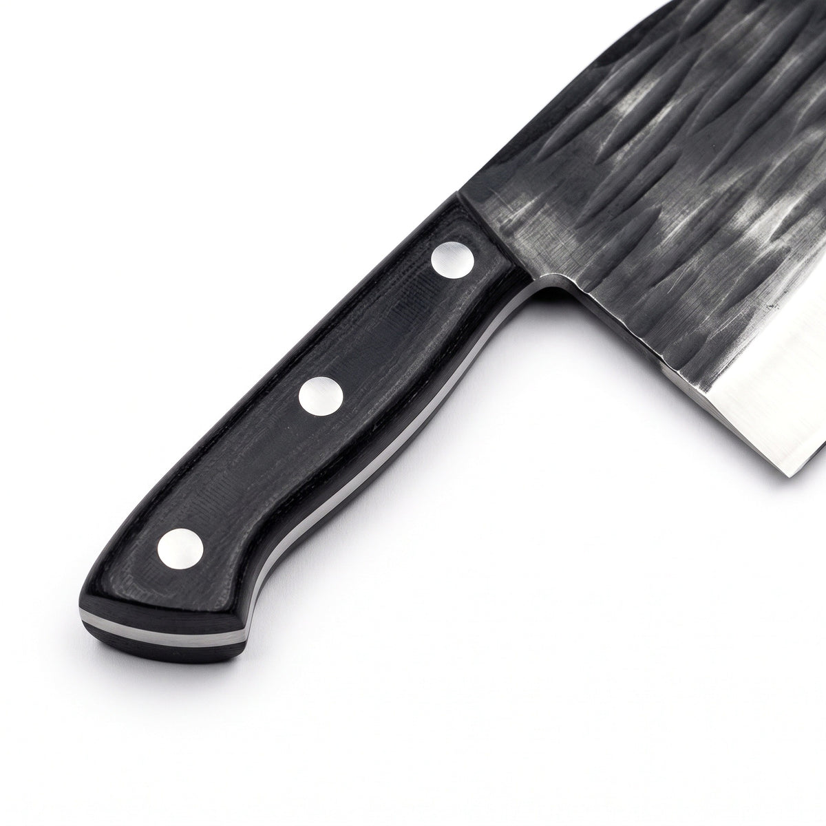 Hollow 7" Carbon Steel Serbian Chef Knife | Black Micarta, handle and fittings close-up