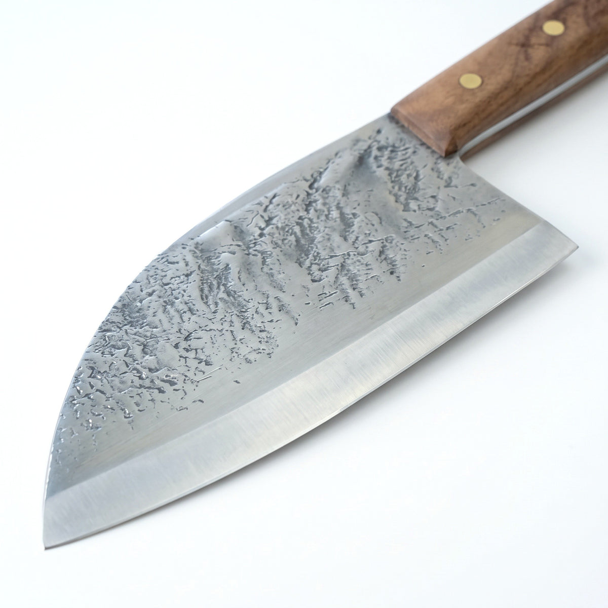 Hollow 7" Carbon Steel Serbian Chef Knife | Walnut, carbon steel blade close-up