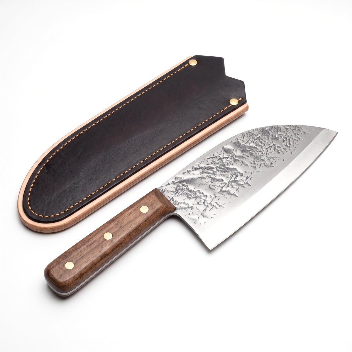 Hollow 7" Carbon Steel Serbian Chef Knife | Walnut, three-quarter view with the Crownridge blade guard
