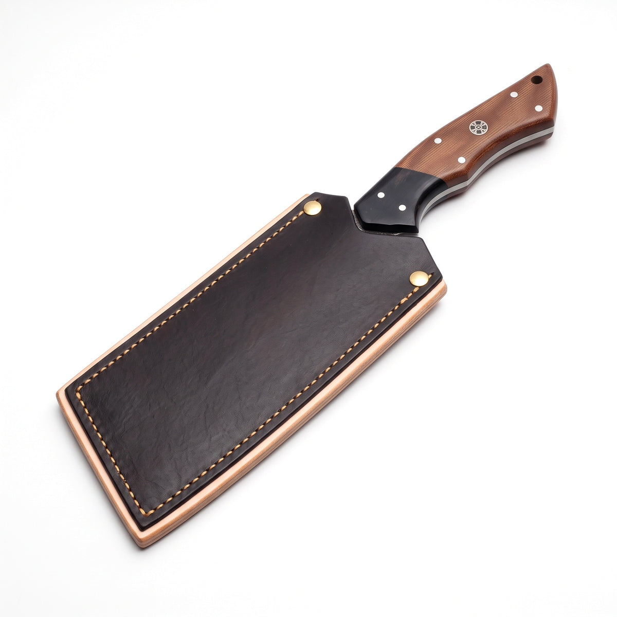 Hollow 8" Damascus Meat Cleaver | Micarta, seated in the Crownridge blade guard