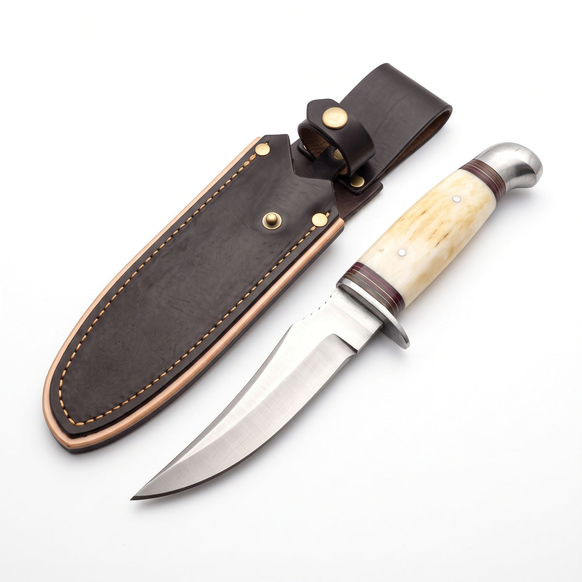 Ridgeback 8.5" Carbon Steel Hunting Knife | Bone & Brass, three-quarter view with the Crownridge sheath