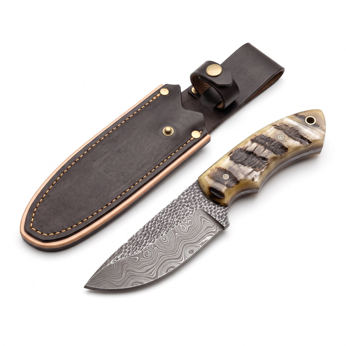 Trailhead 6" Damascus Skinning Knife | Sheep Horn, three-quarter view with the Crownridge sheath