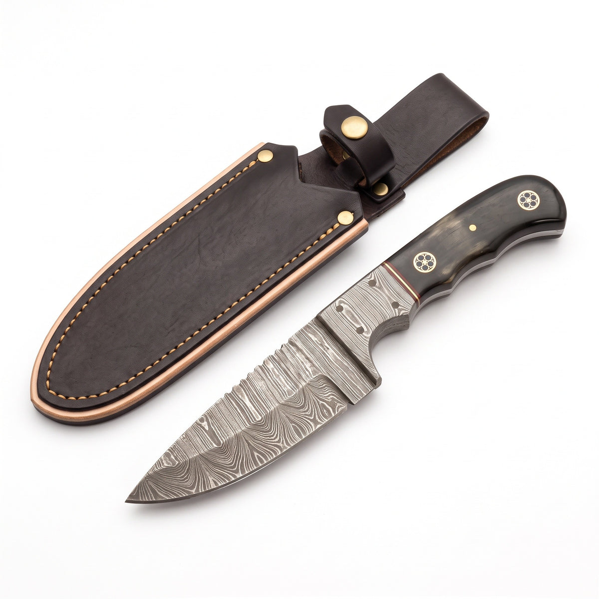 Trailhead 7.2" Damascus Skinning Knife | Buffalo Horn, three-quarter view with the Crownridge sheath