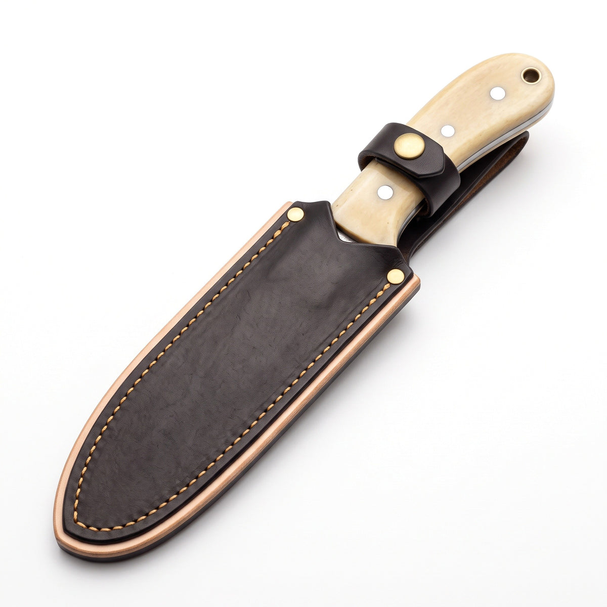 Trailhead 7" Carbon Steel Skinning Knife | Bone, seated in the Crownridge sheath