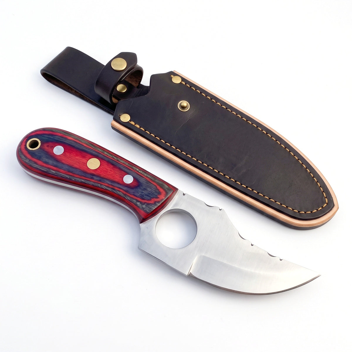 Trailhead 7" Carbon Steel Skinning Knife | Red Dyed Wood, three-quarter view with the Crownridge sheath