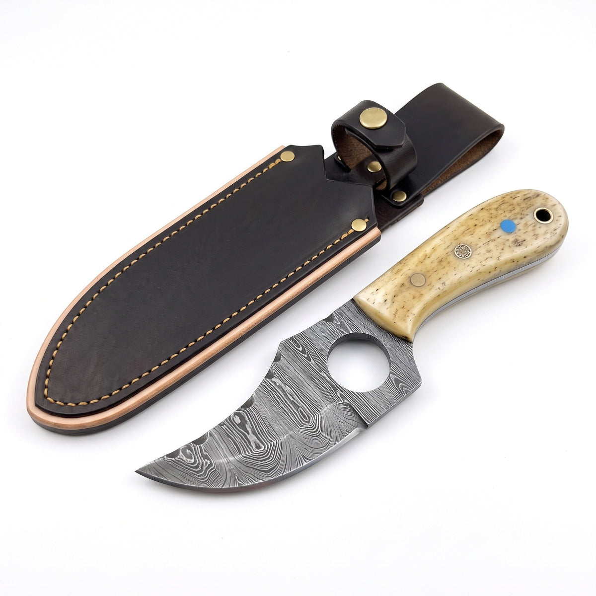 Trailhead 7" Damascus Skinning Knife | Bone, three-quarter view with the Crownridge sheath