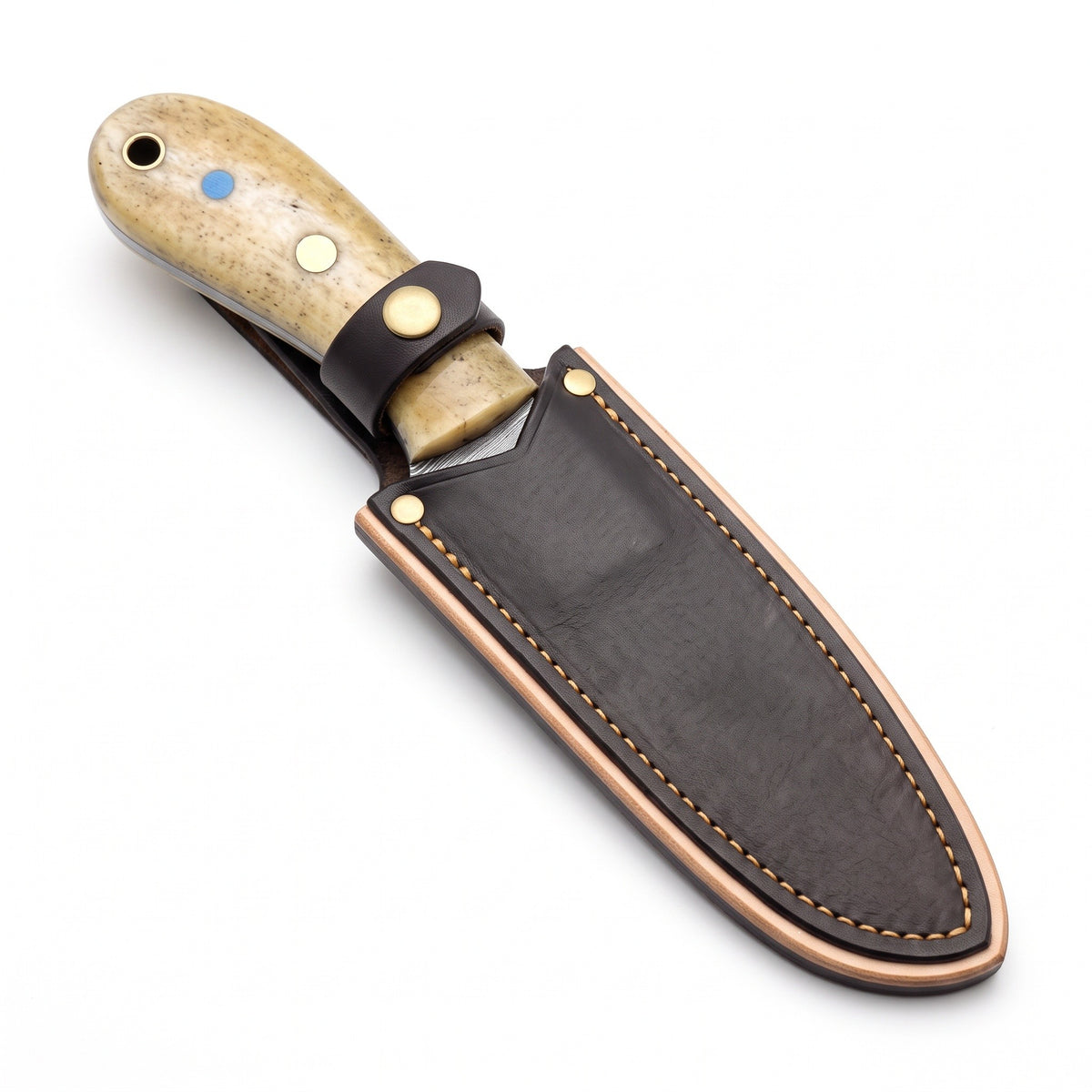 Trailhead 7" Damascus Skinning Knife | Bone, seated in the Crownridge sheath
