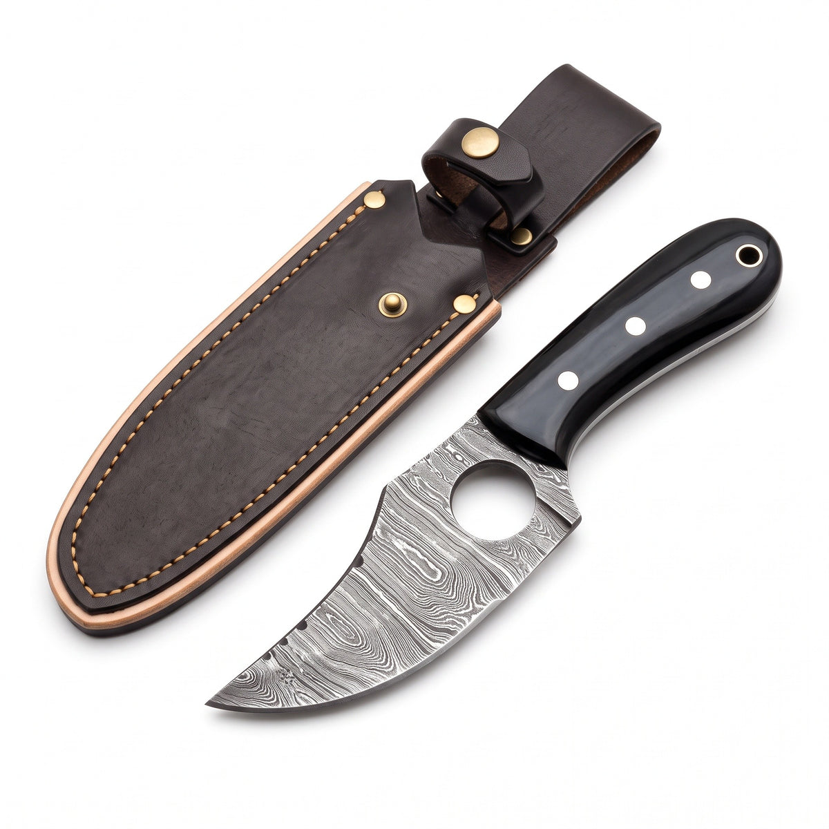 Trailhead 7" Damascus Skinning Knife | Buffalo Horn, three-quarter view with the Crownridge sheath