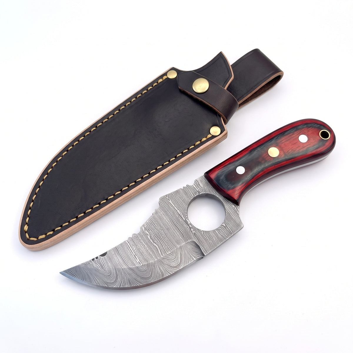 Trailhead 7" Damascus Skinning Knife | Red Dyed Wood, three-quarter view with the Crownridge sheath