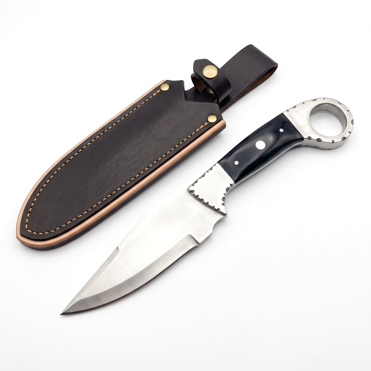 Trailhead 9" Carbon Steel Skinning Knife | Buffalo Horn, three-quarter view with the Crownridge sheath