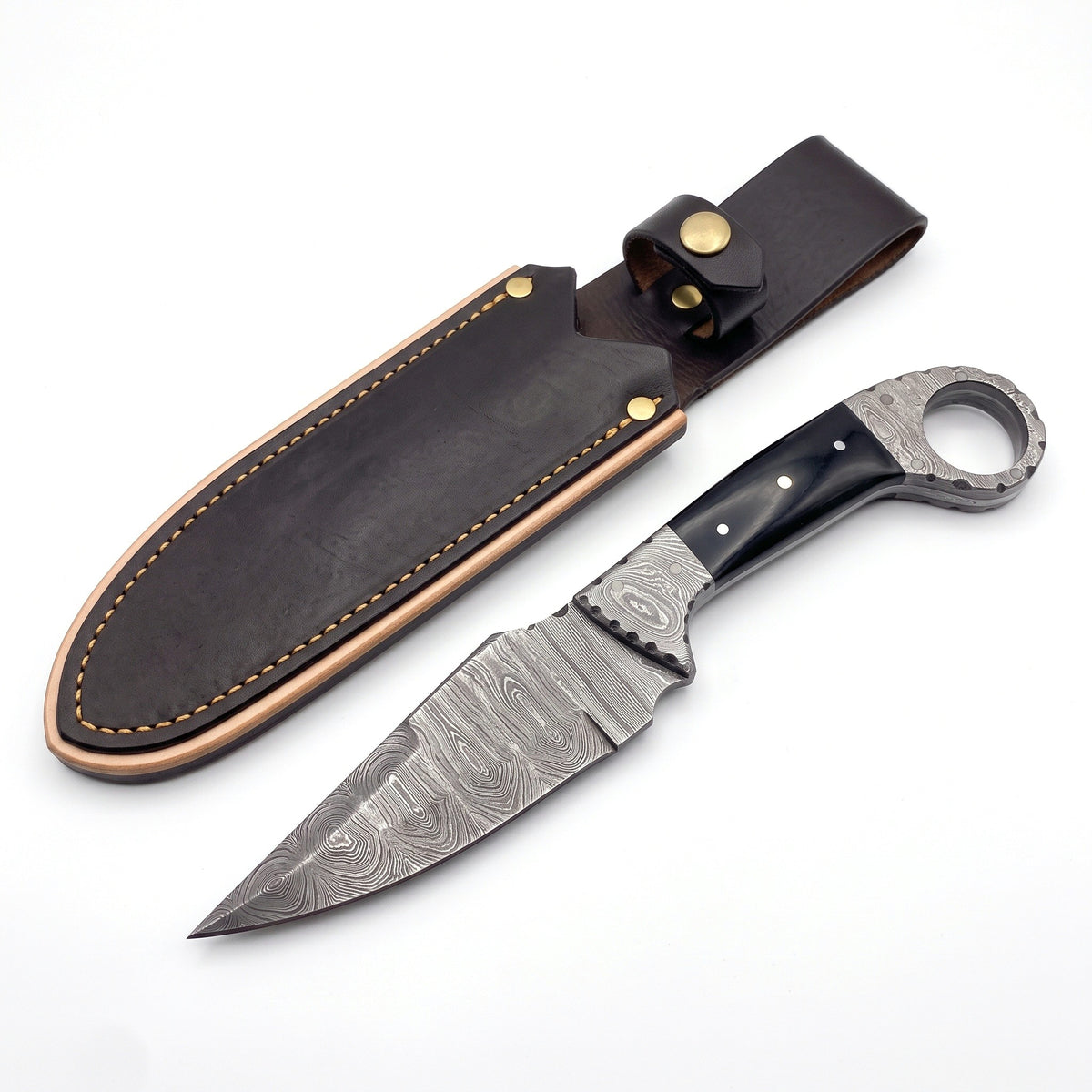 Trailhead 9" Damascus Skinning Knife | Buffalo Horn, three-quarter view with the Crownridge sheath