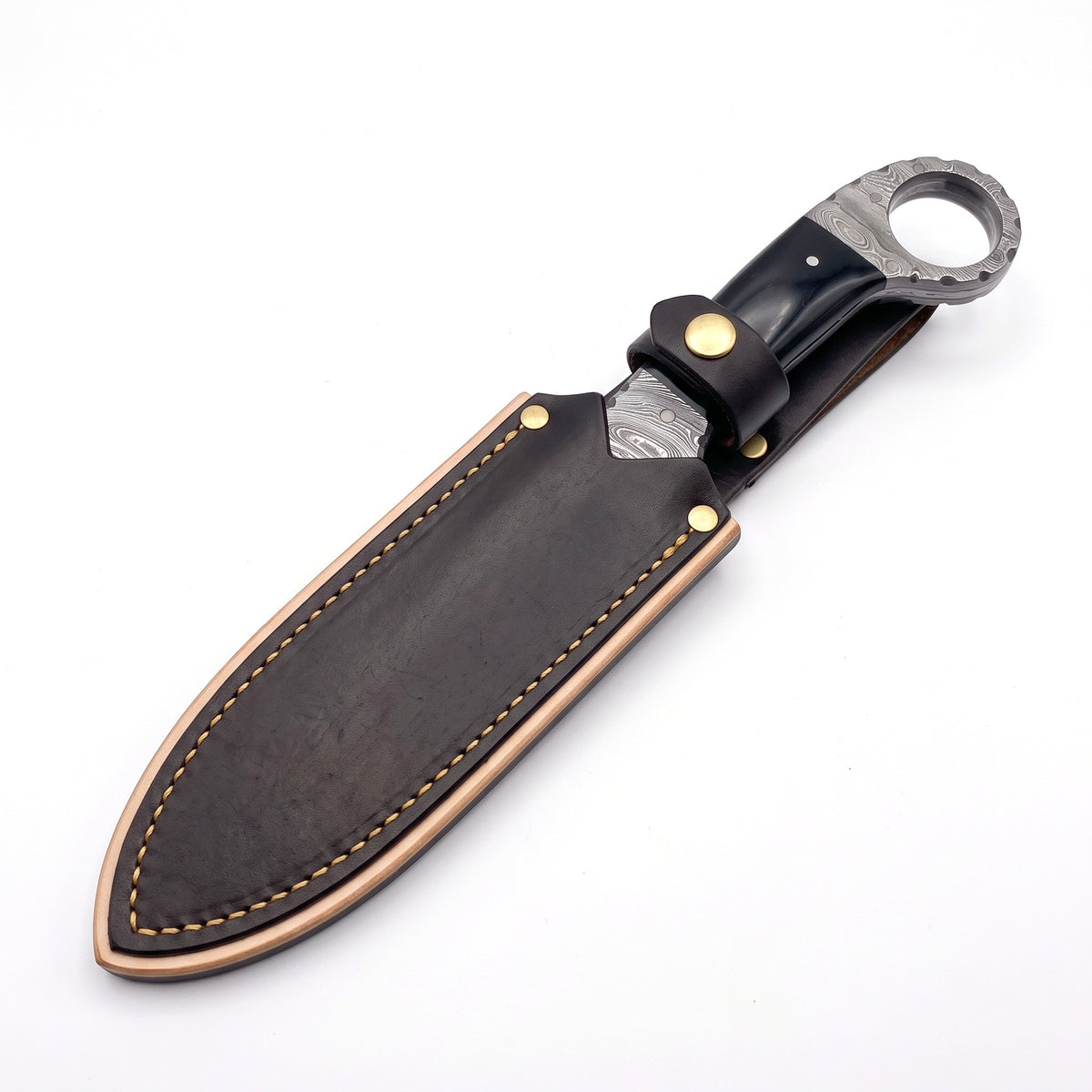 Trailhead 9" Damascus Skinning Knife | Buffalo Horn, seated in the Crownridge sheath